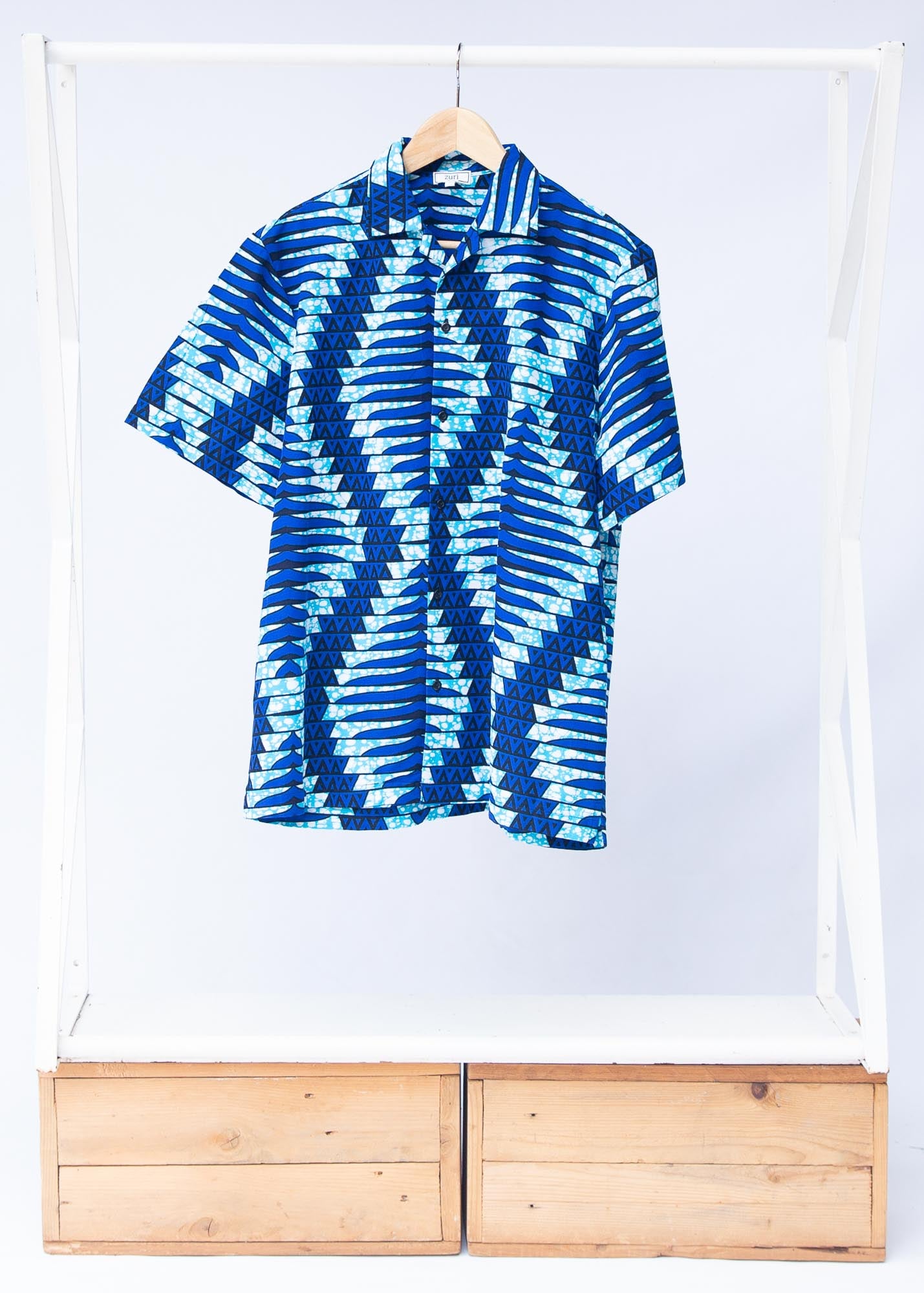 Display of blue, sky blue and white colored men's shirt