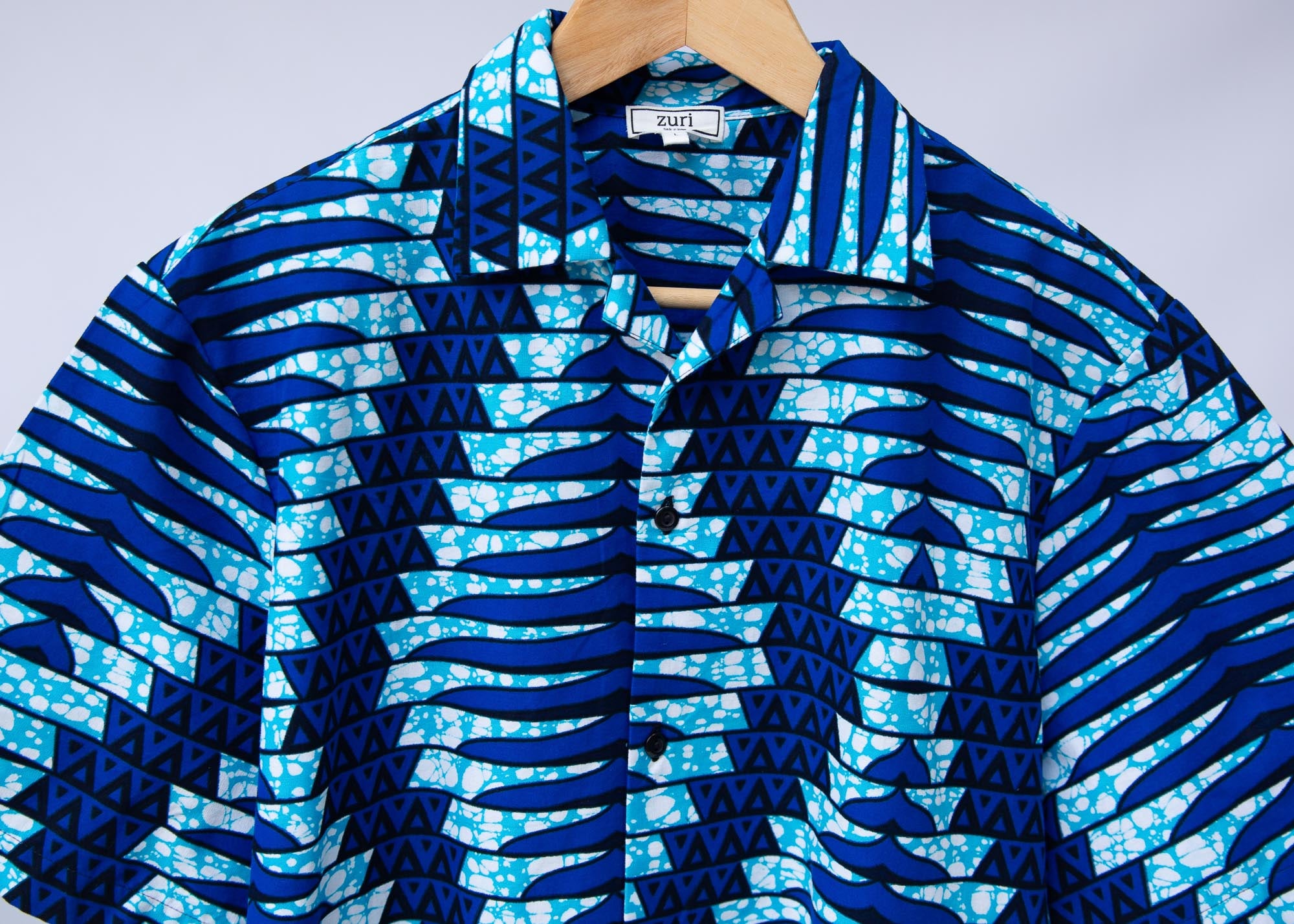 Display of blue, sky blue and white colored men's shirt