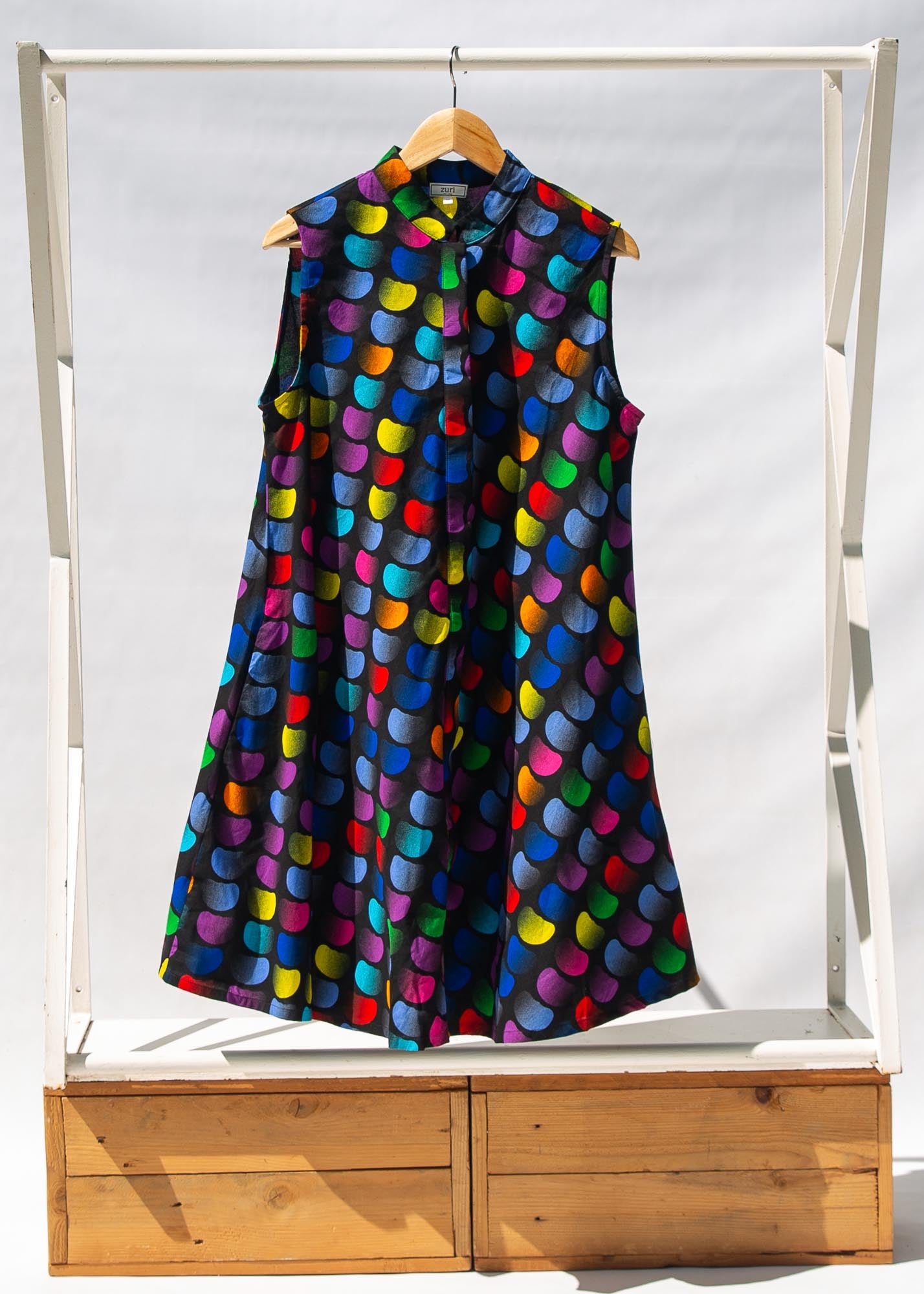 Display of black dress with colorful panel
