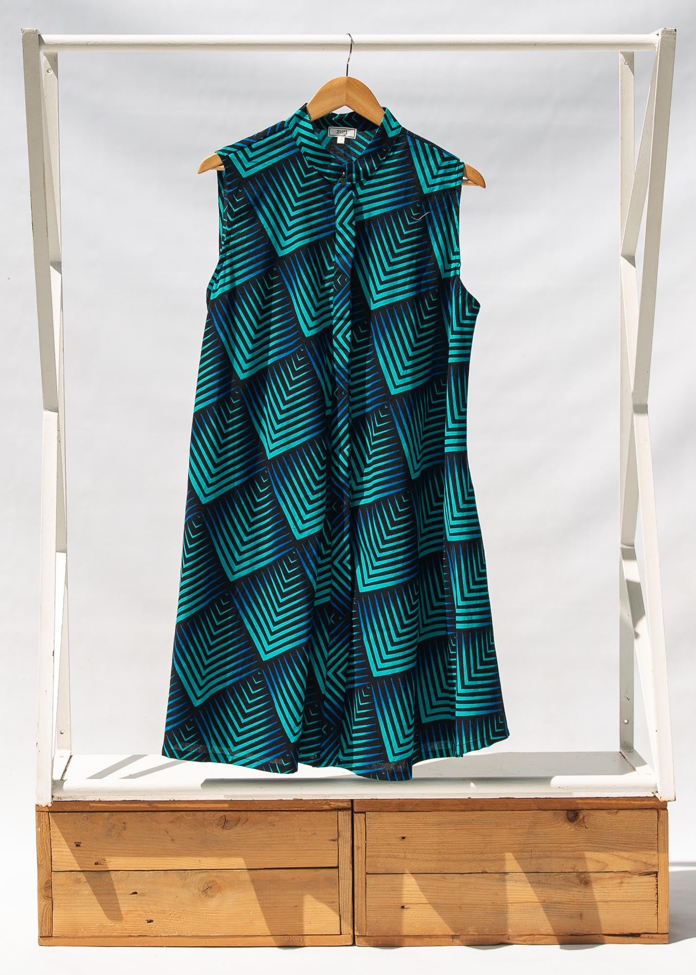 Display of black, blue and aqua print dress