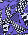 Close up display of purple, black and white geometric print dress
