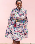 The model is wearing multi-colored floral print 
