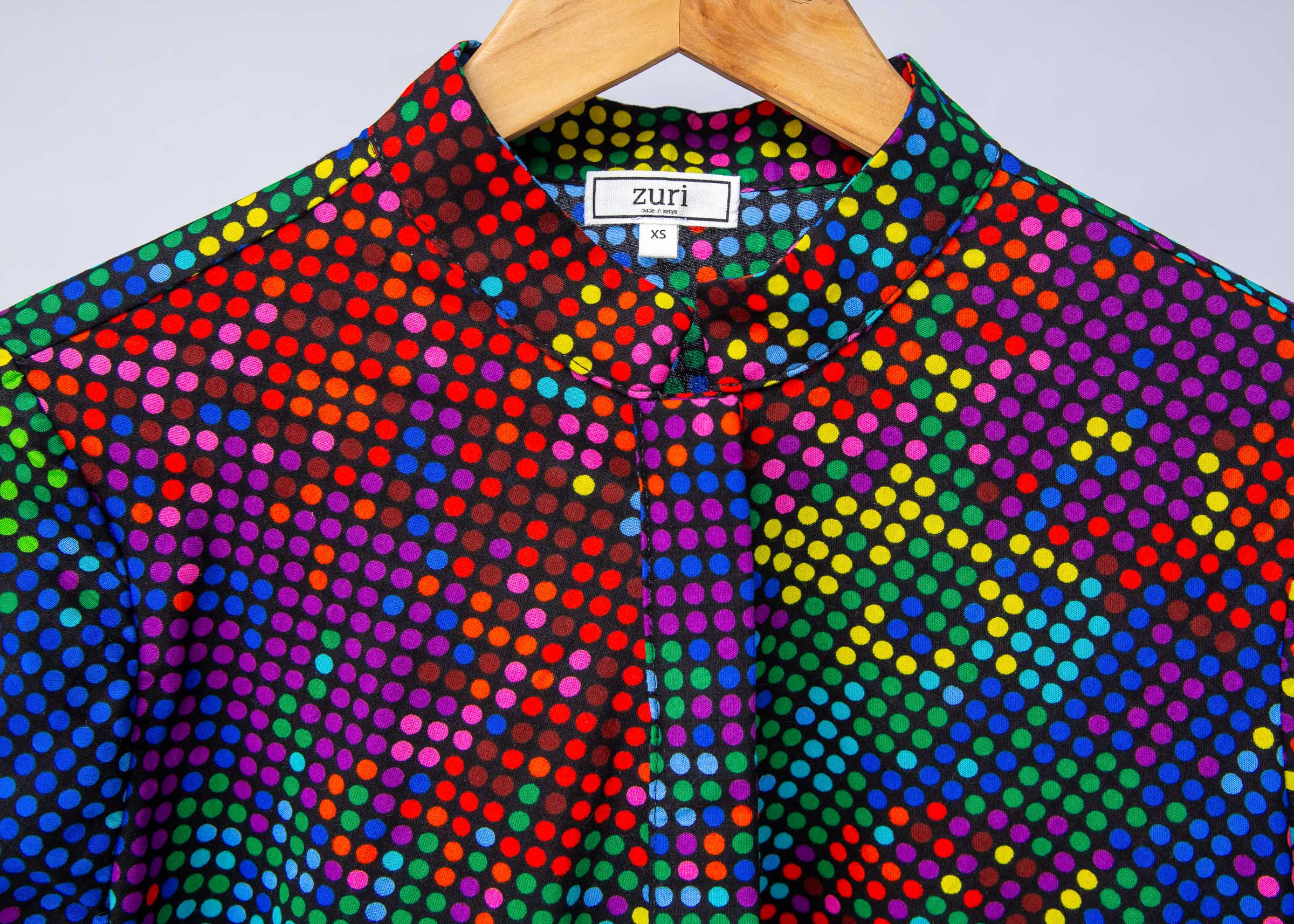 Display of rainbow pixelated print dress. 